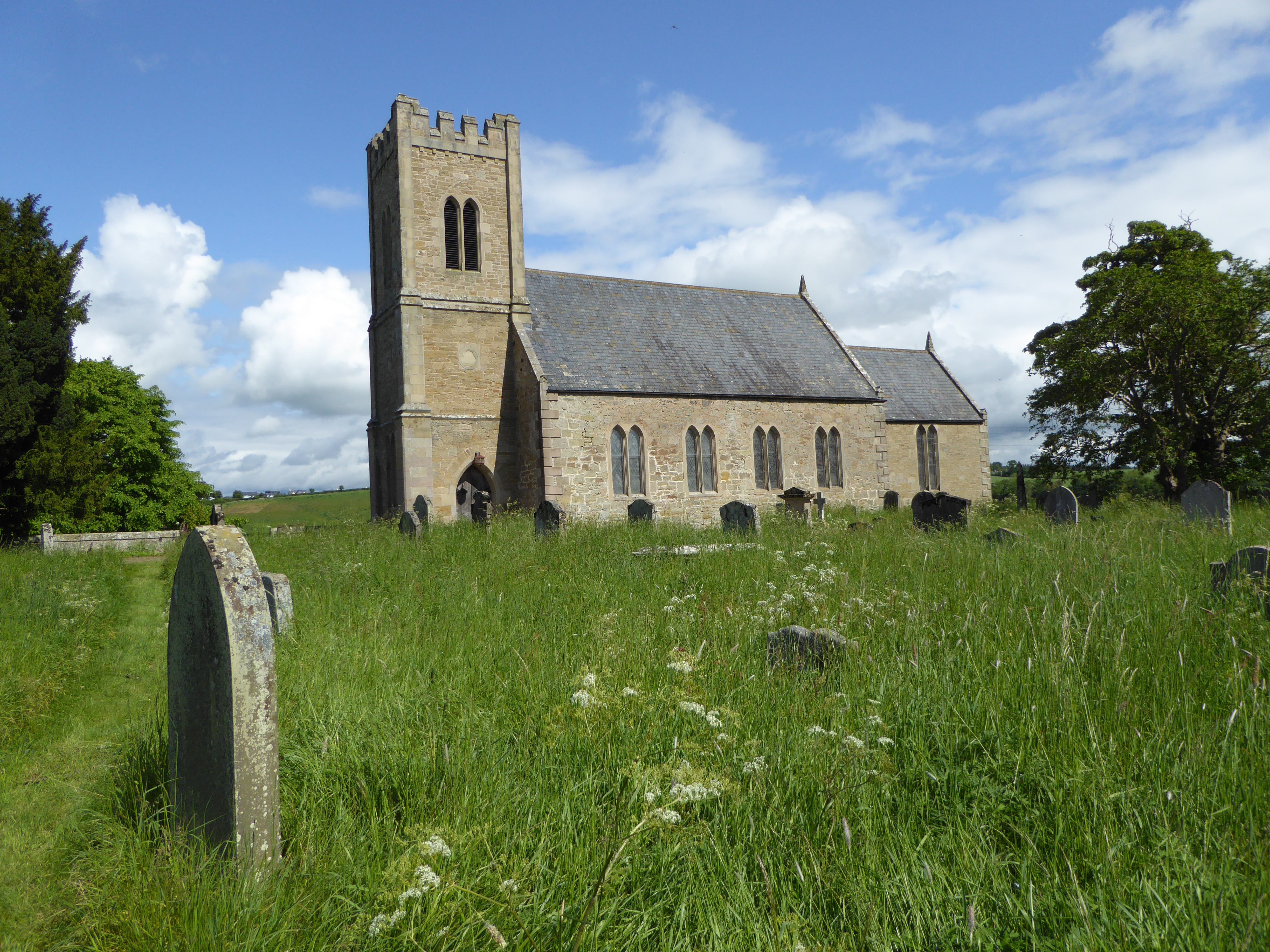 The Church of St Cuthbert, in the hamlet of Carham, is in a beautiful setting on the south bank of the River Tweed